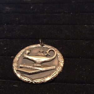 Vintage antique brass Aladdin’s lamp with books medallion